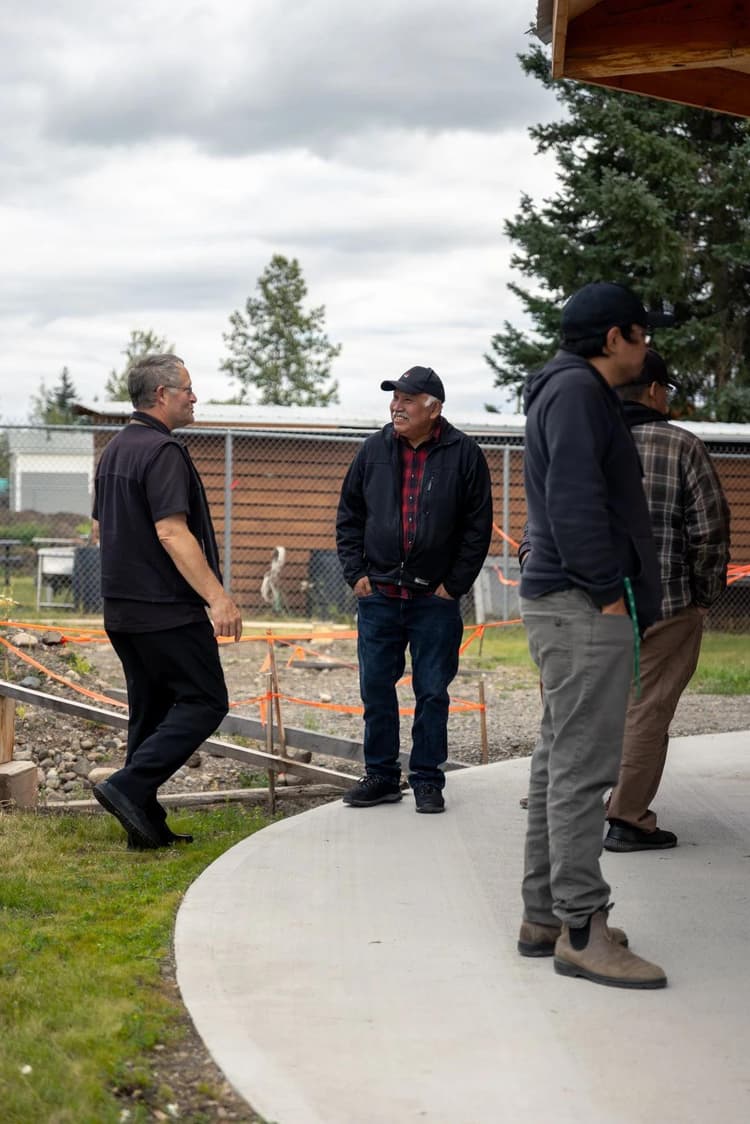 4 men standing around